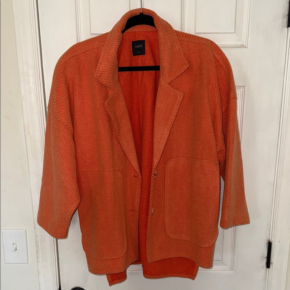 Orange cropped sleeve jacket